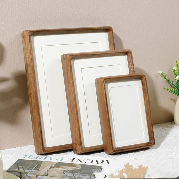 Minimalist Scandinavian photo frame trio in warm wood tone, enhancing cosy modern interiors