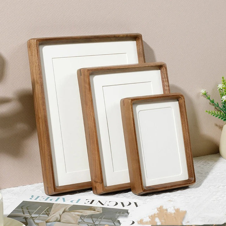 Minimalist Scandinavian photo frame trio in warm wood tone, enhancing cosy modern interiors