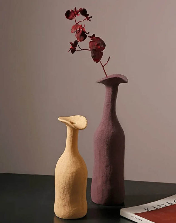 Muted yellow and plum Morandi-style ceramic vases styled with dried flowers, perfect for Scandinavian interiors