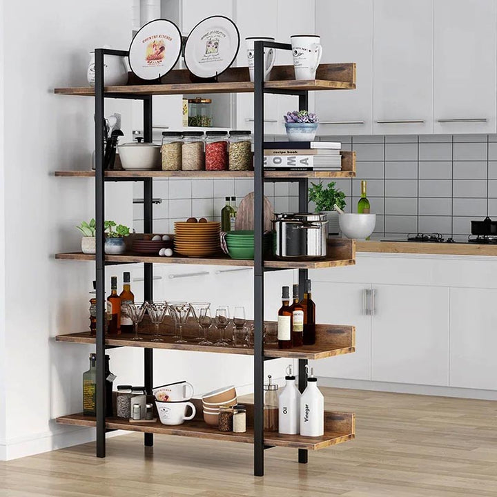 Industrial bookshelf used as kitchen storage rack, styled with dishes and decor, showcasing multifunctional use.