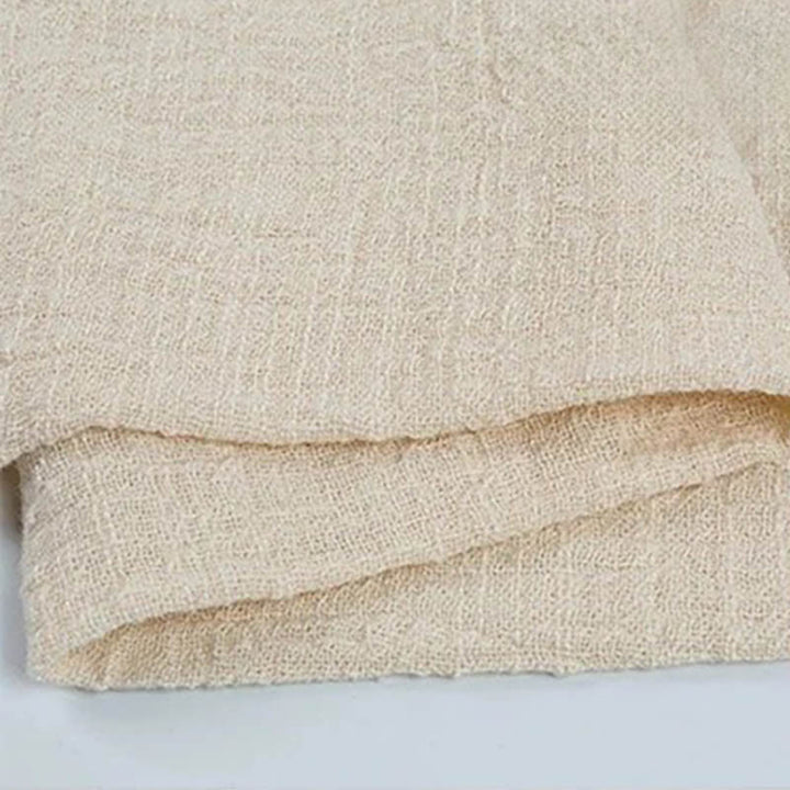 Folded Ivory cotton napkin for Weddings and Elegant uk Dining Decor on the white table.