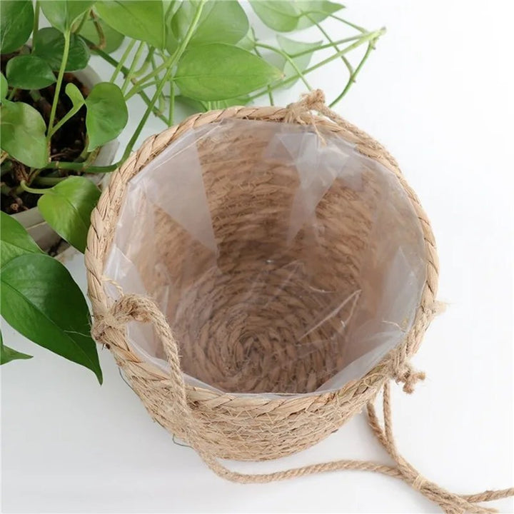 Woven basket with jute rope handles on a white background