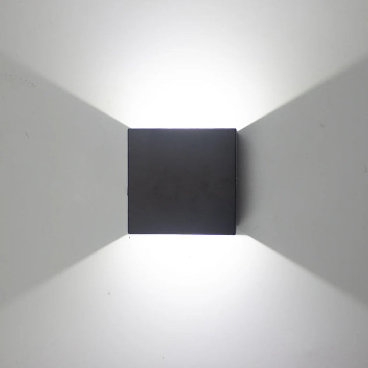 KUBE matte black aluminium LED wall lamp with cool white Scandinavian style wall illumination