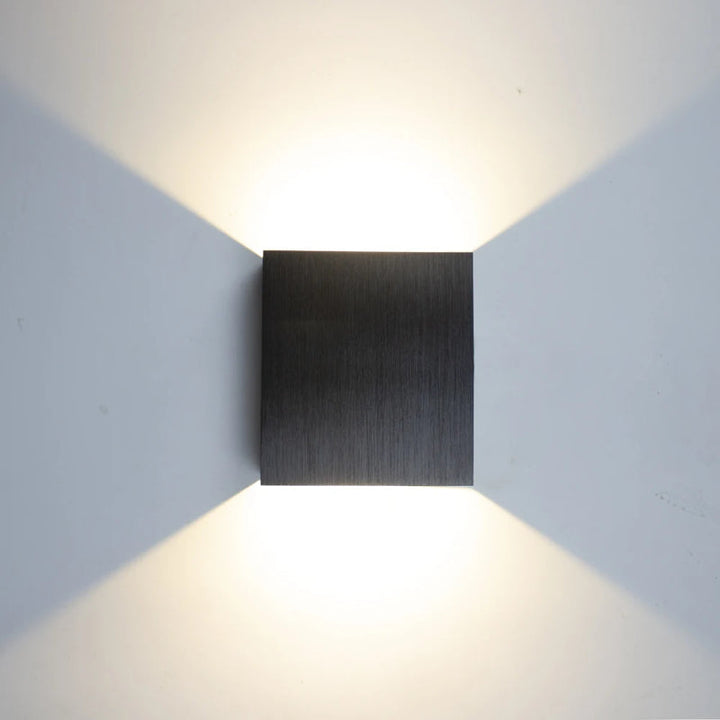KUBE brushed black aluminium LED wall lamp with cool white two-way modern wall illumination