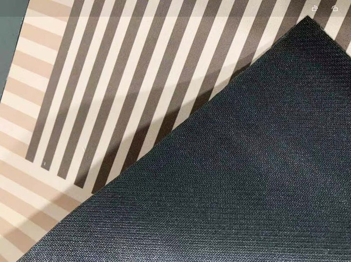 Back view of Nordic Kitchen Floor Mat showing black anti-slip base and striped beige and brown polyester surface
