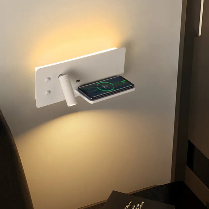Wall-mounted charging station with a smartphone on a white wall