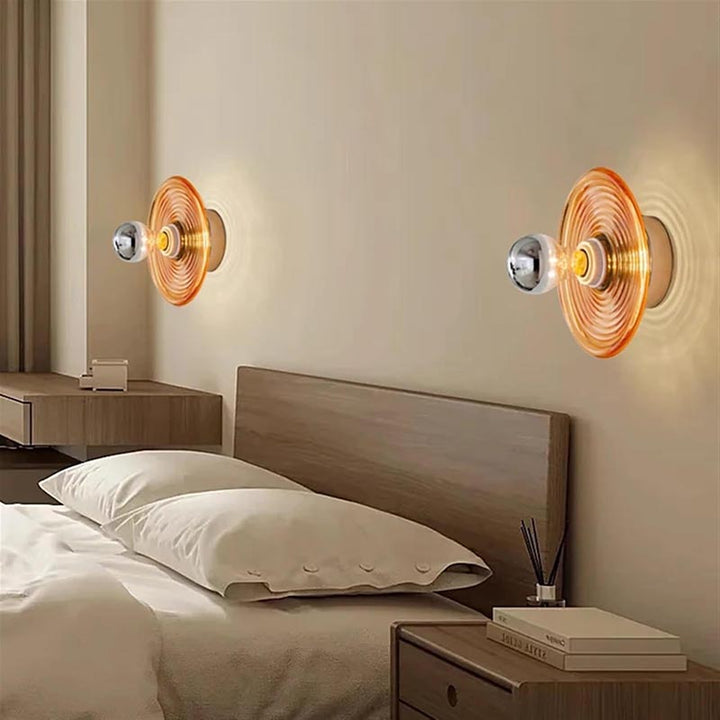 Modern bedroom with wall sconces and a bed