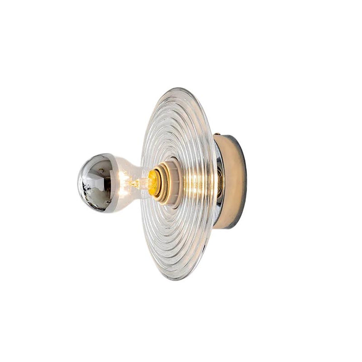 Decorative wall light fixture with a clear glass shade on a white background