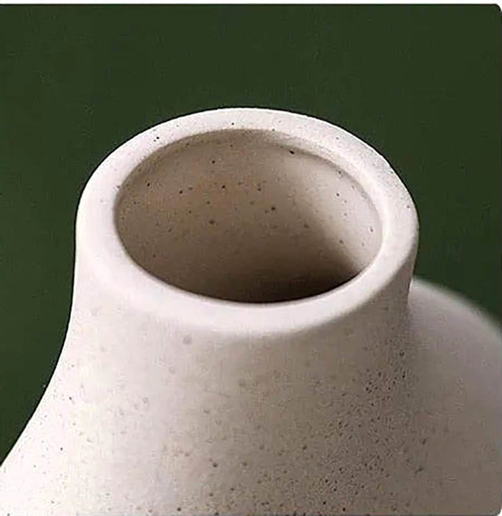 Close-up of LER Nordic ceramic vase opening, highlighting matte sand-textured beige finish and minimalist silhouette
