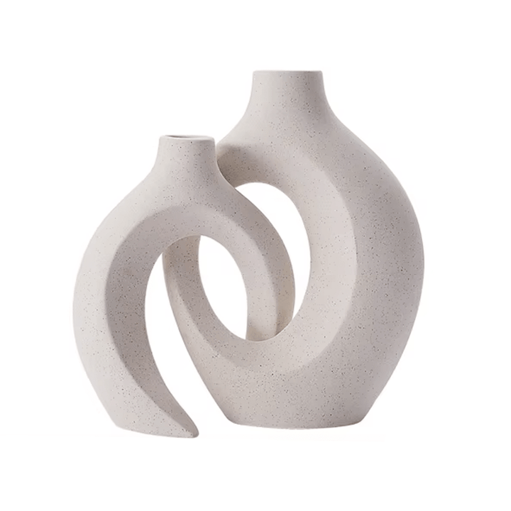 Set of two sculptural ceramic vases with looped design in matte beige, perfect for Nordic or minimalist home styling