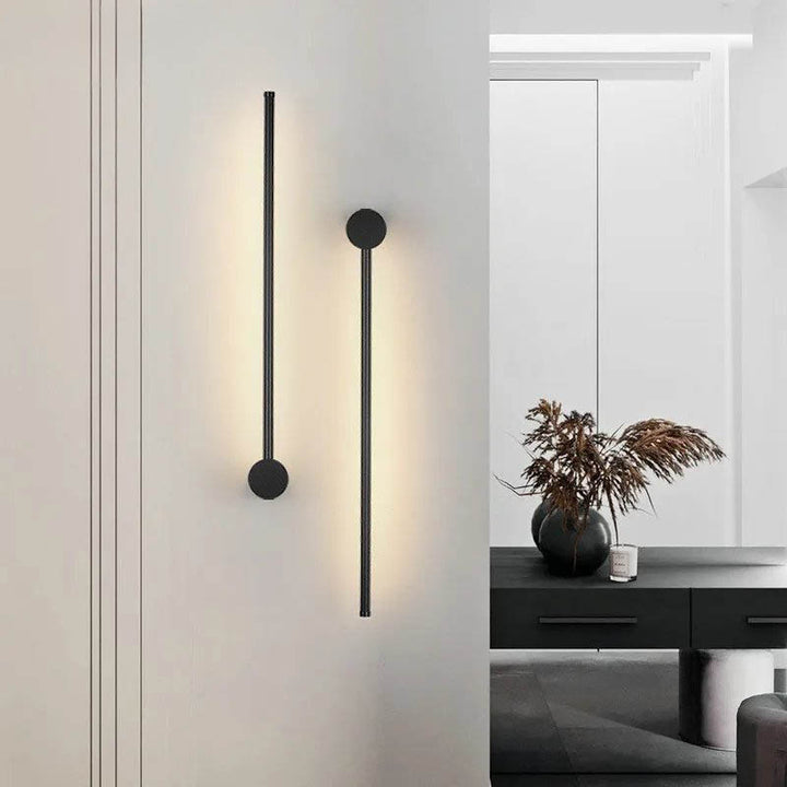 Minimalist LED wall lights on a neutral hallway wall with indoor plant décor, perfect for UK Scandinavian interiors.