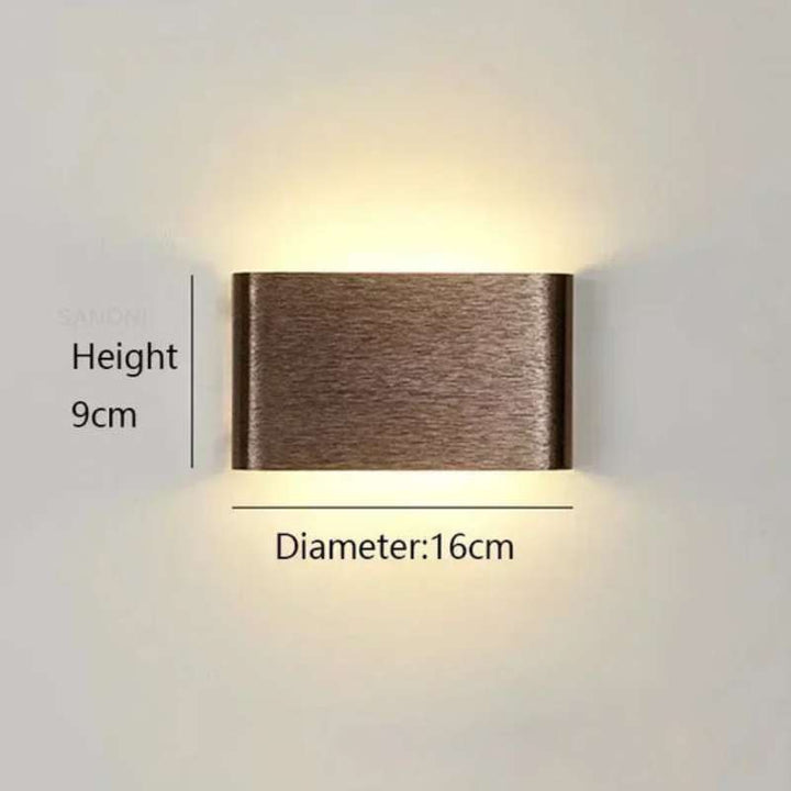 Small rectangular LYST LED wall lamp, 16cm x 9cm, brushed finish with warm Scandinavian glow