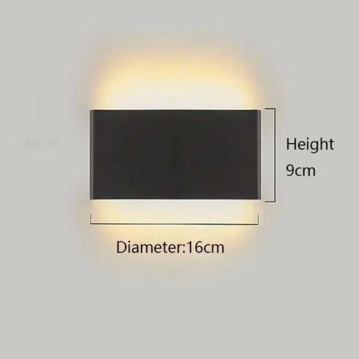 Small black rectangular LYST LED wall lamp, 16cm x 9cm, warm minimalist Scandinavian lighting
