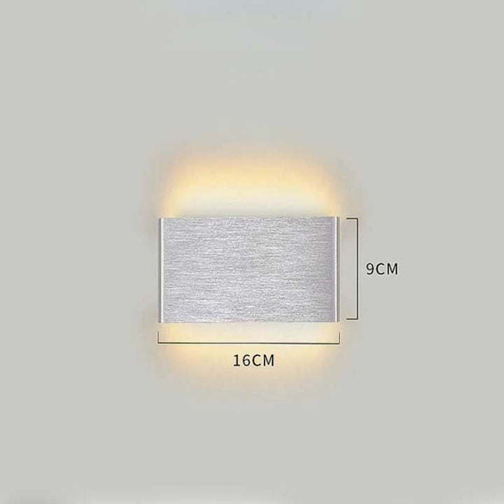 Small silver brushed LYST LED wall lamp, 16cm x 9cm, modern Scandinavian compact wall light