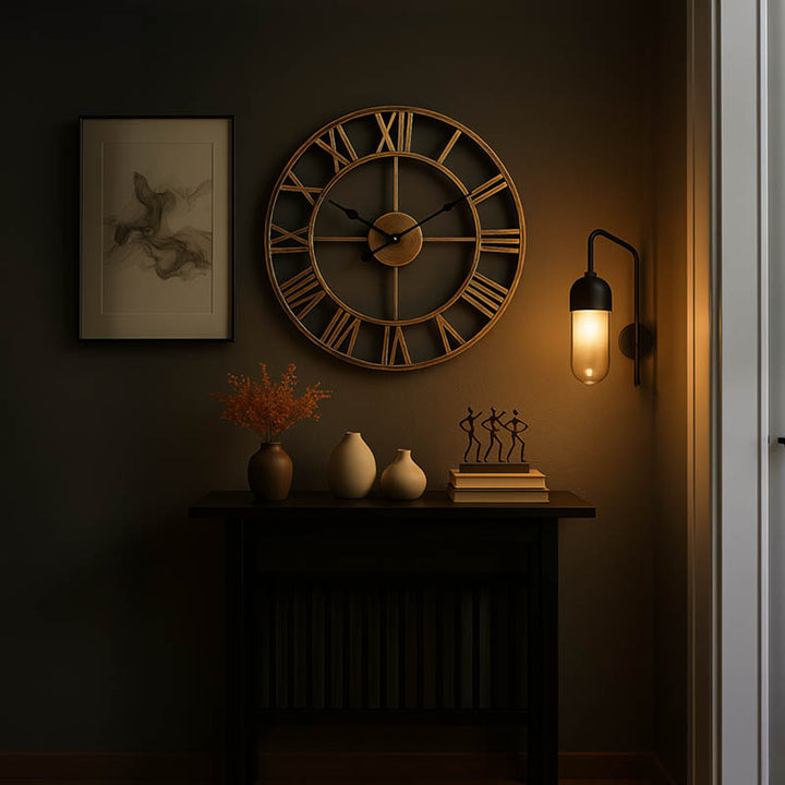 Rustic industrial Roman numeral wall clock in bronze metal, 40cm, styled on white wood sideboard with modern decor.