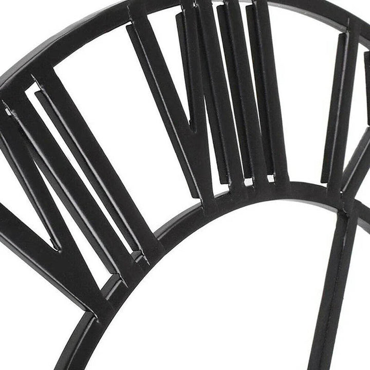 Black open-frame Roman numeral wall clock in matte metal, 40cm, close-up showing slim profile and modern design.