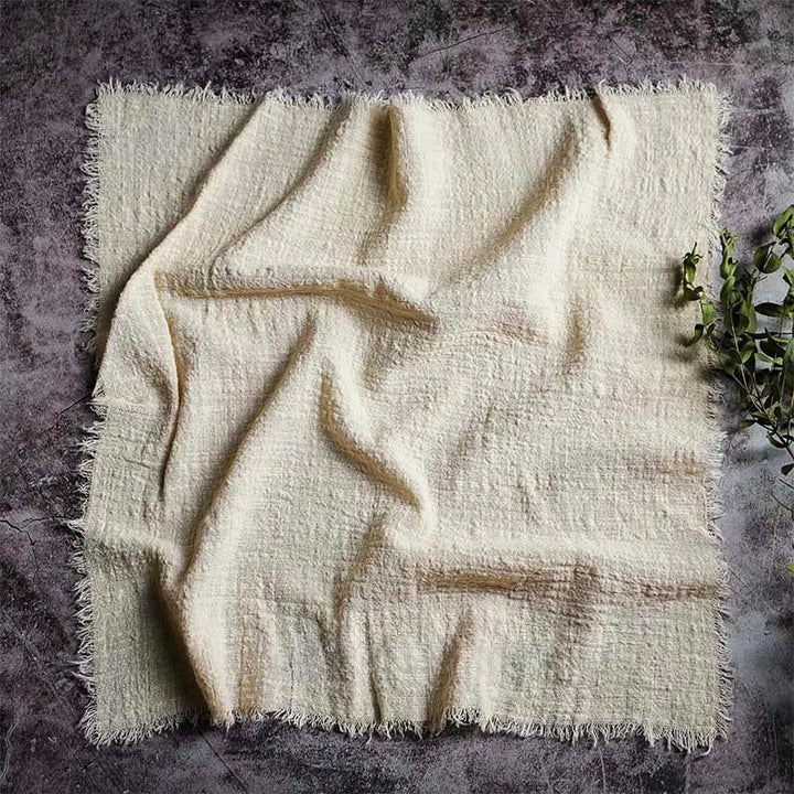 Natural off-white cotton gauze napkin, 16 x 16 inches, with soft texture and frayed edges – perfect for minimalist Scandi table settings.