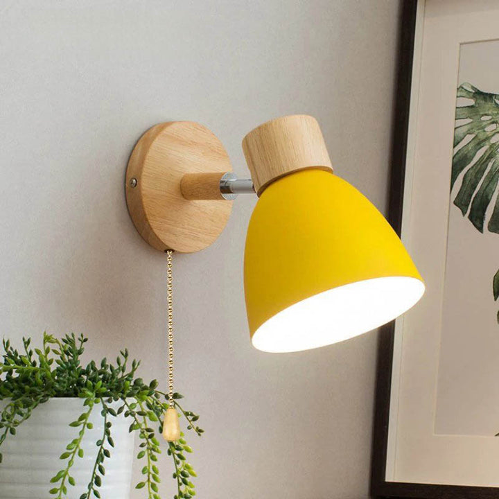 Yellow Scandinavian-style wall sconce with wooden base, E27 fitting, perfect for cozy bedroom or hallway lighting