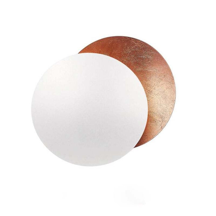 Dual copper discs of MÅNE Solar Eclipse Wall Light with metallic finish, designed for modern interiors.