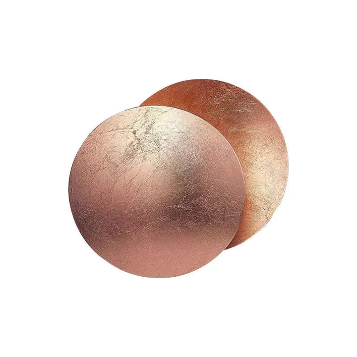 Copper-toned MÅNE Solar Eclipse Wall Light with overlapping round panels in a metallic sheen.