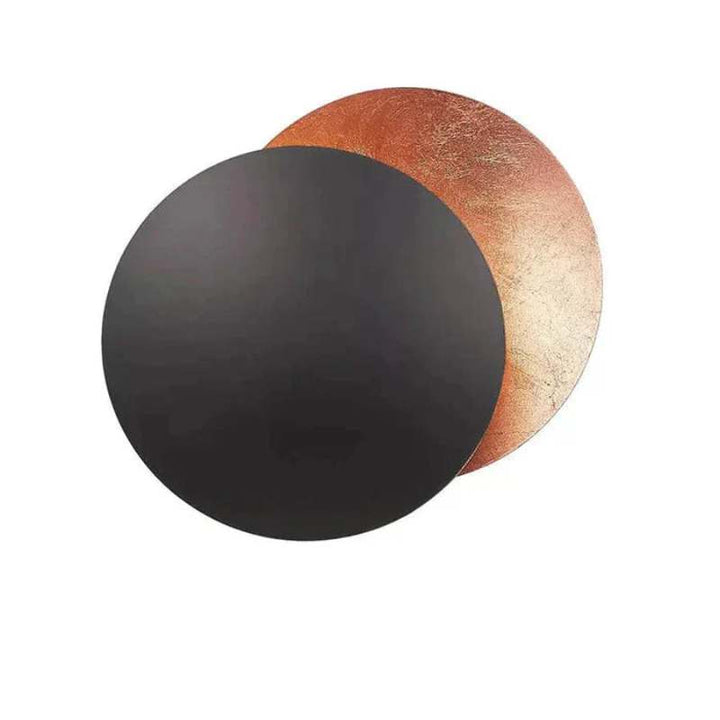 Black and copper MÅNE Solar Eclipse Wall Light creating a bold eclipse effect for statement walls.