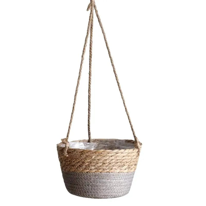 Woven hanging basket with a rope handle on a white background