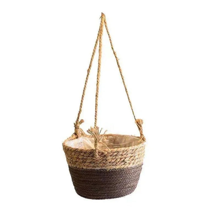 Woven hanging basket with a rope handle on a white background
