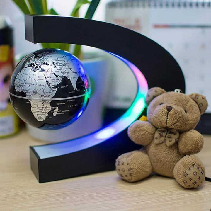 Magnetic Levitation Globe Lamp with black C-shaped base, floating black and silver world map, LED night light for home office decor