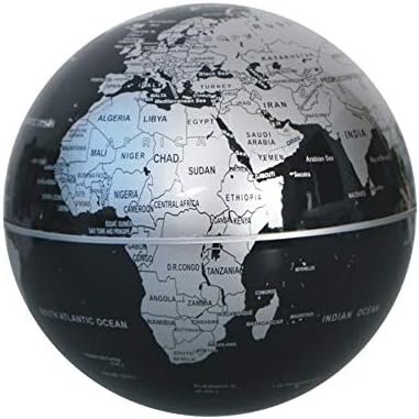 Black magnetic levitation globe lamp close-up with detailed silver world map, stylish floating night light for home office