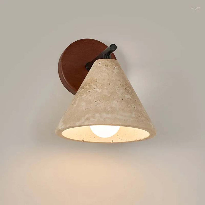 Minimalist Wall-mounted light fixture with concrete-like shade and brown base on a neutral background