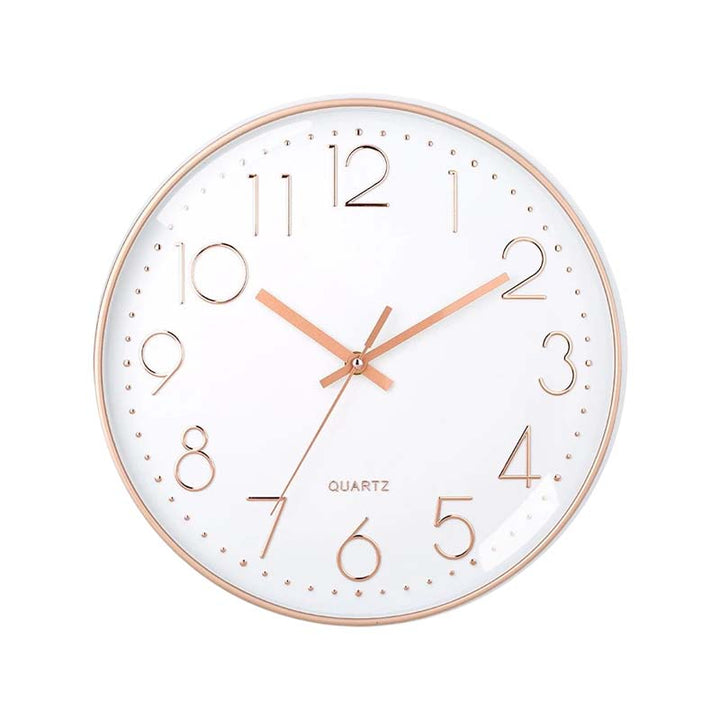 Round wall clock with rose gold frame and hands on a white background
