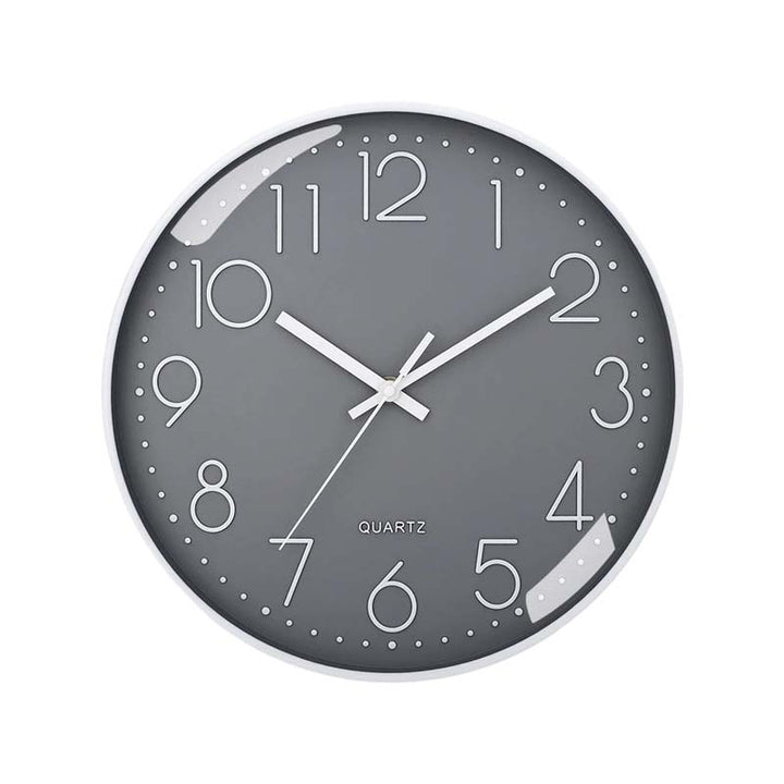 Gray wall clock with white numbers and hands on a white background