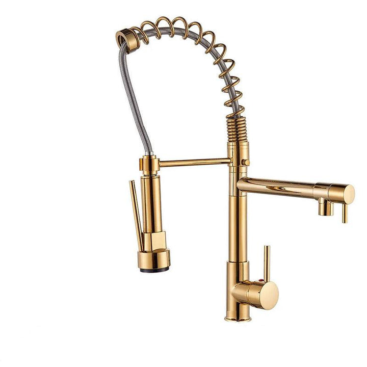Gold commercial-style pull-down kitchen faucet with exposed spring coil, black sprayer handle, and side pot filler.