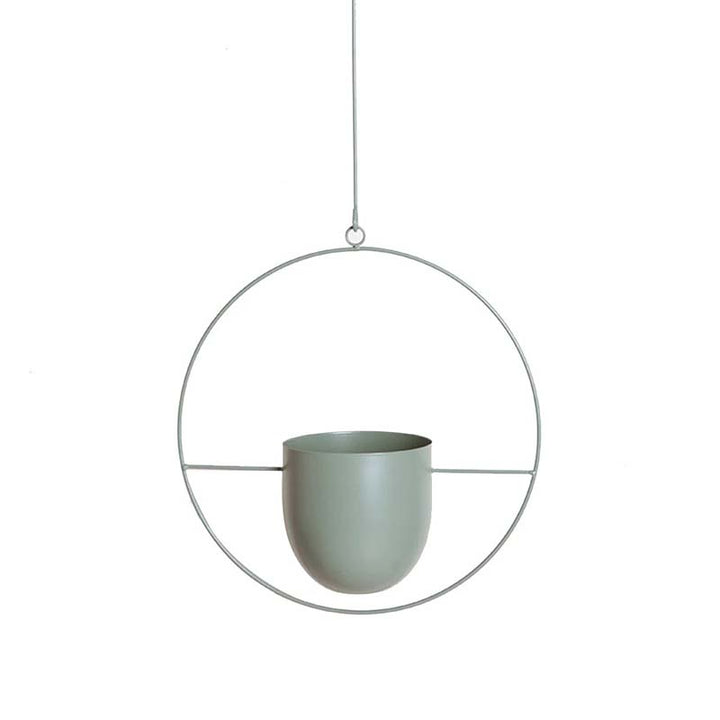 Hanging metal circle planter with a olive green pot on a white background
