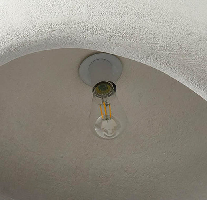 Close-up view of bulb fitting inside the HAETTE pendant light showing inner texture and light fixture