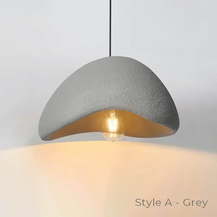 HAETTE Style A in grey cement finish, illuminated with warm LED light from within