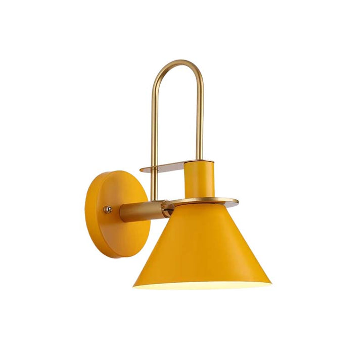 Yellow wall lamp with gold fixture on a white background