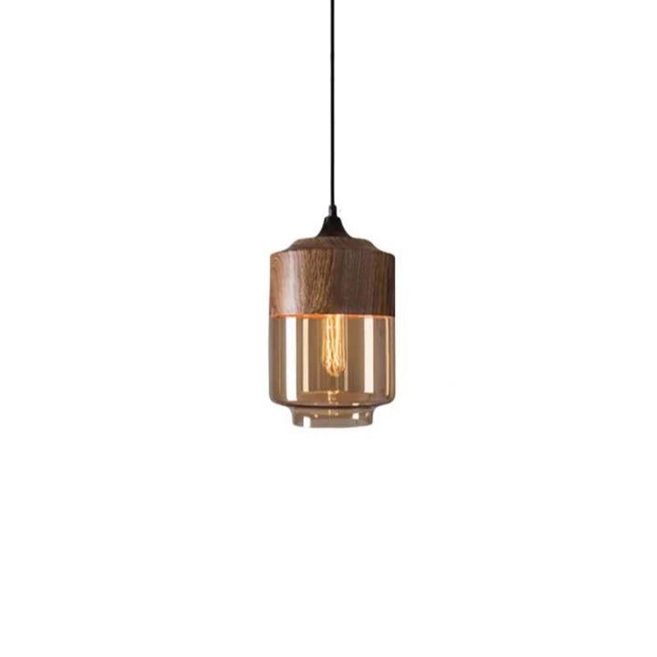 Wooden pendant light with clear glass shade on a white background