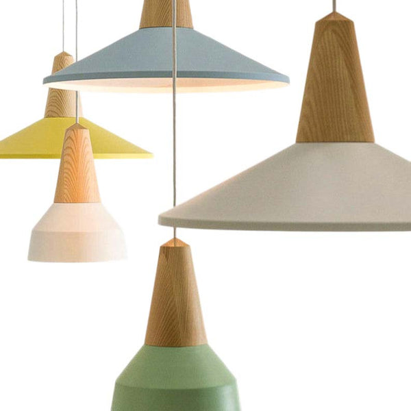 Set of colorful pendant lights with wooden accents on a white background