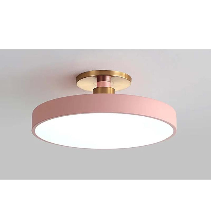 Ceiling light fixture with pink and gold design on a gray background