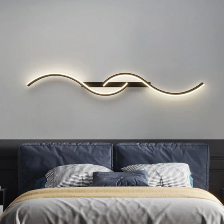 Modern horizontal LED wall lamp with sculptural wave design, soft uplighting for UK bedrooms or lounges