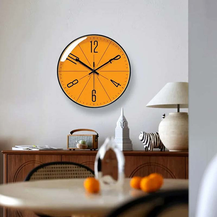 Modern orange wall clock in a living room, sleek silent clock for dining area or modern apartment decor