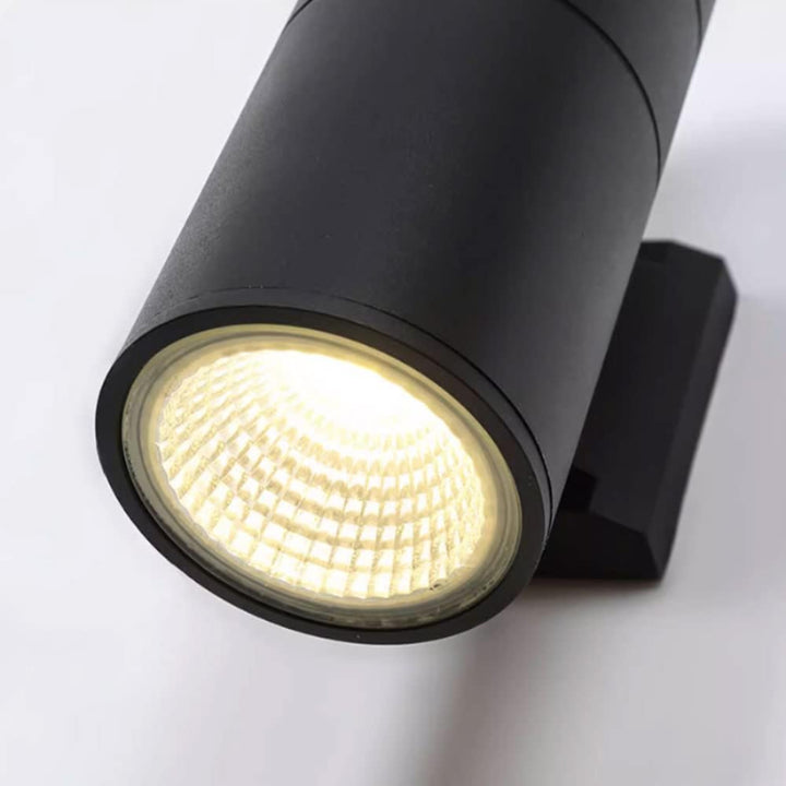 Black cylindrical spotlight on a white background