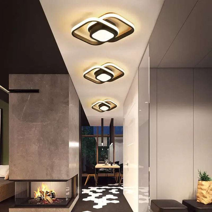 Corridor with black double ring LED ceiling lights creating warm modern ambience