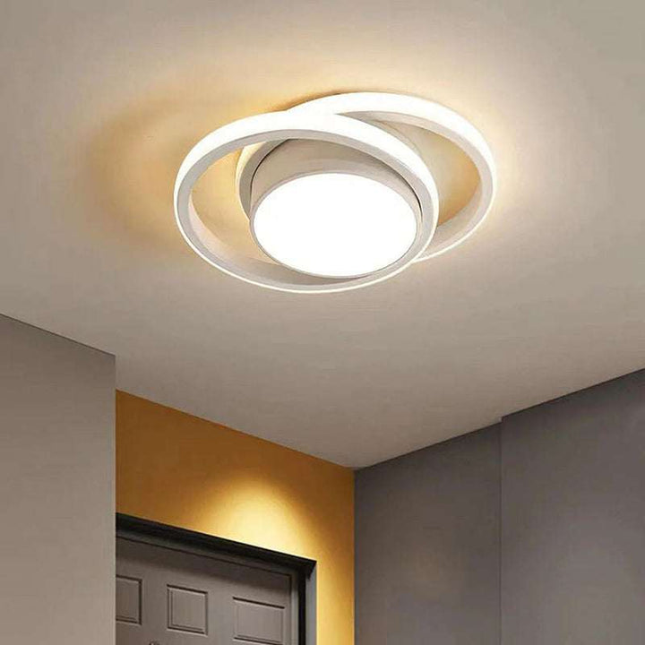 White double ring LED ceiling light in modern hallway with neutral walls