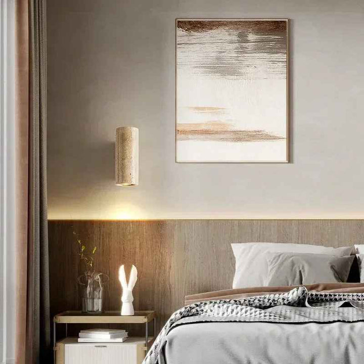 Modern bedroom with abstract art, Nordic Wall Lamp, and bed with gray bedding.