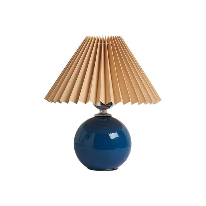 Modern table lamp with blue ceramic base and natural pleated shade, ideal for Nordic bedside or reading lighting.