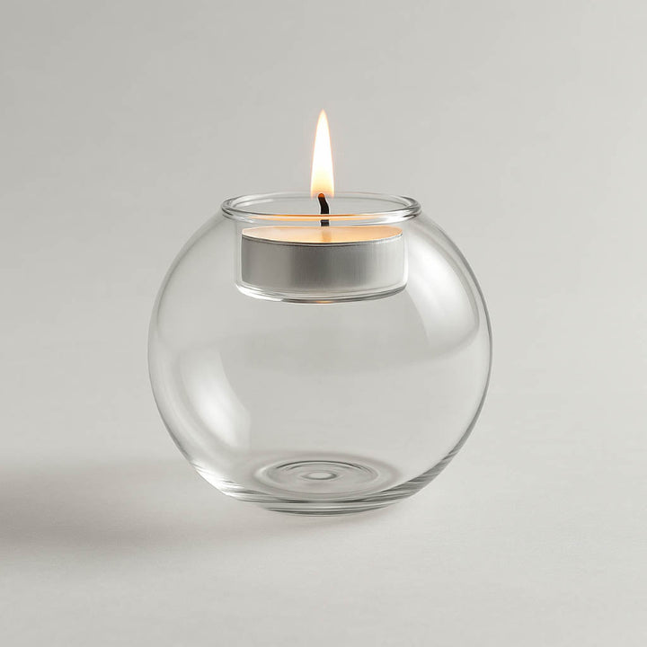 Minimalist round glass tealight holder on white studio background, ideal for modern uk home décor