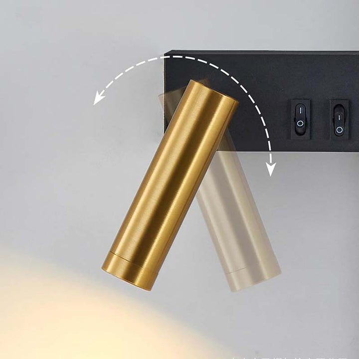 Gold and silver cylindrical wall lights on a gray background
