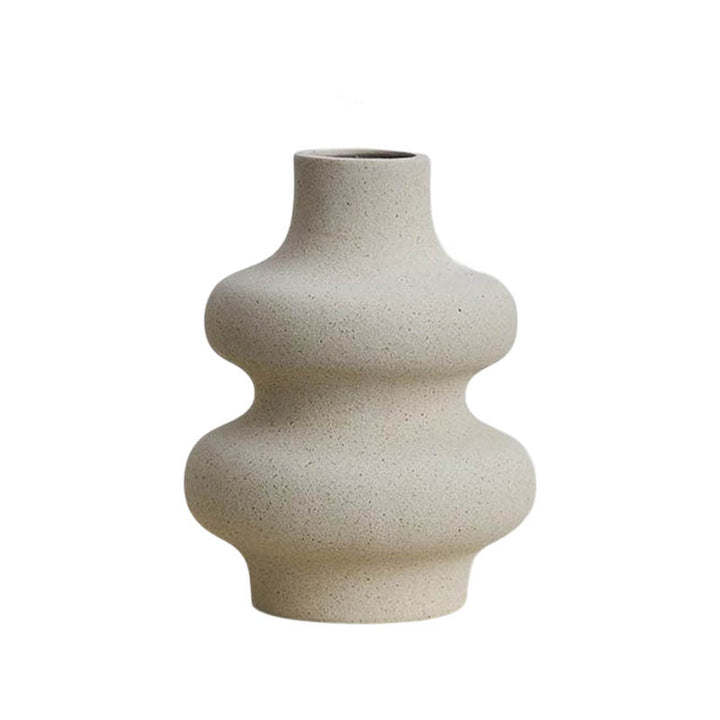 Modern minimalist ceramic vase with curved silhouette, neutral sand finish, Nordic Essentials UK home decor